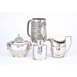 A Late Victorian Silver Embossed Tankard by William Henry Leather, Birmingham 1899, with shaped