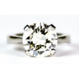 A Diamond Solitaire Ring, Modern, platinum set with a brilliant cut round diamond, approximately 4.