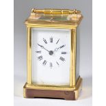 An Early 20th Century French Carriage Clock the white enamel dial with Roman numerals to the two