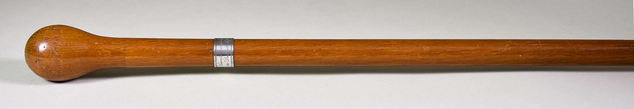 An Oak Walking Cane with Plain Handle and Engraved Silver Ferrule, worded -"Canterbury Cathedral