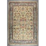 A 20th Century Indian Carpet of Kirman Design, woven in pastel shades, the field filled with