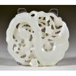 A Chinese White Jade Pendant, 19th Century, pierced and carved with a bird and flowering tree,