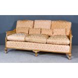 An Early 20th Century Mahogany Framed Bergere Lounge Suite, with double caned panelled back and