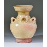 A Chinese Glazed Pottery Globular Ewer, Southern Dynasties, with raised neck and bird spout and