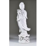 A Chinese Blanc de Chine Porcelain Figure of Guan Yin, 20th Century, red printed marks, 20ins (50.