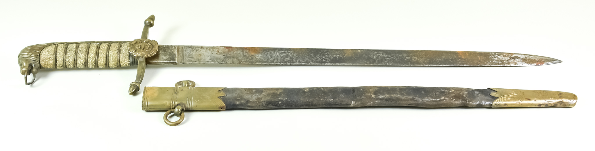 A 19th Century British Naval Dirk, 17.5ins blade, brass cross guard with anchor emblem, ray skin