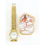 An 18ct Gold Carved Cameo Brooch, 42mm x 54mm, and a plated lady's wristwatch by Raymond Weil, on