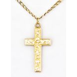 A 15ct Gold Cross Pendant, Modern, engraved with leaf scroll work, gross weight 4.4g, on 9ct gold