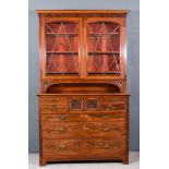 A Victorian Mahogany Bookcase, the upper part fitted three shelves enclosed by pair of lead-glazed