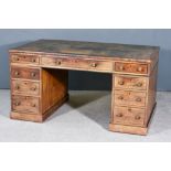 A Late George III Partners Mahogany Kneehole Desk, with tooled leather inset to top, fitted nine