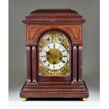 A Late 19th Century German Mahogany Cased Mantel Clock, by Junghans, the arched brass dial with 5.