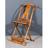 A Chinese Elm Yoke Back Folding Chair, 19th Century, with rattan seat and pierced splat
