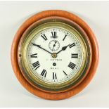 A Brass Bulk Head Time Piece, 20th Century, by F Cotton of Deal, 7ins diameter brass case, white