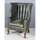 An 18th Century High Back Easy Chair, with curved back upholstered in dark green leather with studs,
