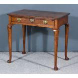 A George II Mahogany Side Table, with moulded edge to top and re-entrant front corners, fitted one