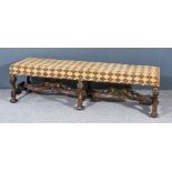 A Walnut and Parcel Gilt Rectangular Fender Stool of "Carolean" Design, the seat upholstered in gold