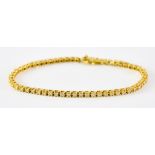 An 18ct Gold Diamond Tennis Bracelet, Modern, set with approximately 2.75ct, 210mm overall, gross