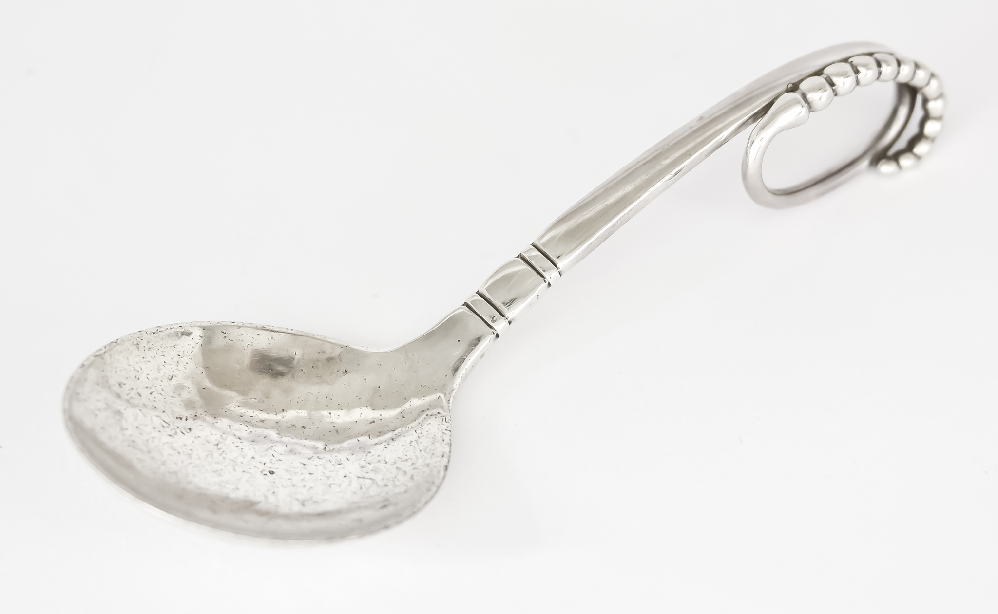 A 20th Century Danish Silver Caddy Spoon, by Georg Jensen, with import mark for London, 1967,