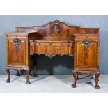 An Early 20th Century Mahogany Breakfront Sideboard of Georgian Design, by Maple & Co., the shaped