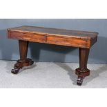 An Early Victorian Rosewood Rectangular Library Table, with figured veneer top, fitted two frieze