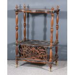 A Victorian Figured Walnut and Ebonised Canterbury Whatnot, of serpentine outline, with pierced fret