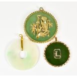 Three Oriental Jade Pendants, 20th Century, one depicting a bird in bamboo set with small gems, 55mm