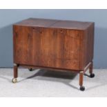 A 1960s Danish CFC Silkeborg Rosewood Veneered Enclosed Drinks Trolley, the twin lifting lids