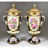 A Pair of Continental Porcelain and Gilt Metal Mounted Two-Handled Urns and Covers, Late 19th