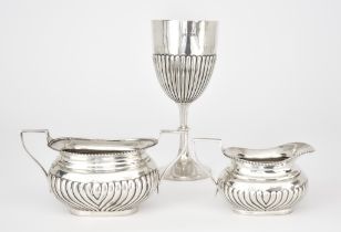 A Late Victorian Silver Goblet and an Edward VII Two-Handled Sugar Basin and Milk Jug, the goblet by
