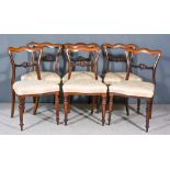 A Set of Six Early Victorian Rosewood Dining Chairs, with shaped crest rails, carved splats,