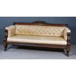 A Regency Rosewood and Gilt Brass Mounted Settee, the shaped crest rail with carved leaf centre