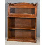 An Early 20th Century Mahogany Bookcase, with shaped gallery and moulded edge to top, fitted one