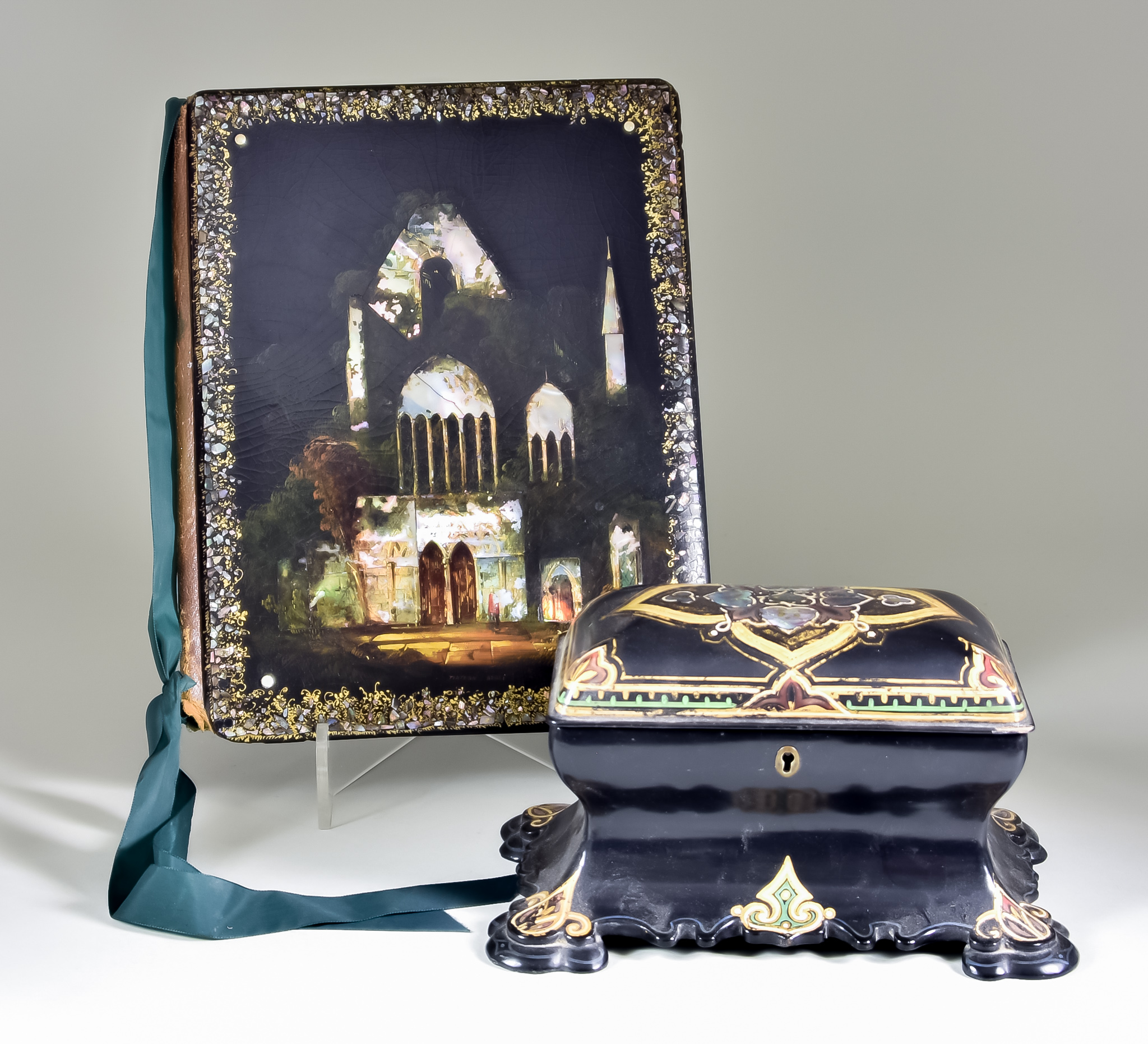 A Victorian Black Papier Mache Rectangular Two-Division Tea Caddy of Waisted Form, painted and