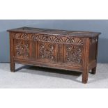 A 17th Century Panelled Oak Coffer, with three panels to top with moulded rails, three panels to