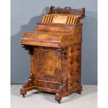 A Victorian Figured Walnut Piano Fronted Harlequin Davenport, with fretted rising stationery rack,