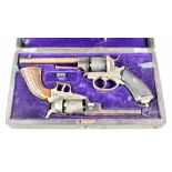 An Unusual Cased Pair of Non Matching Pistols, (possibly travelling salesman), comprising - .32