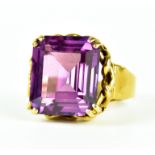 A Faceted Purple Stone Dress Ring, 20th Century, 9ct gold, set with a faceted purple stone,