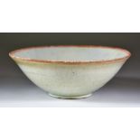 A Chinese Qin Bai Bowl, Song Dynasty, with pale celadon crackle glaze, on short foot with inverted