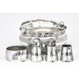 An Iraqi Silvery Metal and Niello Three Piece Condiment Set, Napkin Ring and a Persian Basket, the