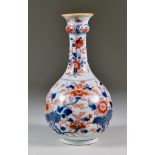 A Chinese Porcelain Guglet, Early 18th Century, painted in under glazed blue and over glazed red and