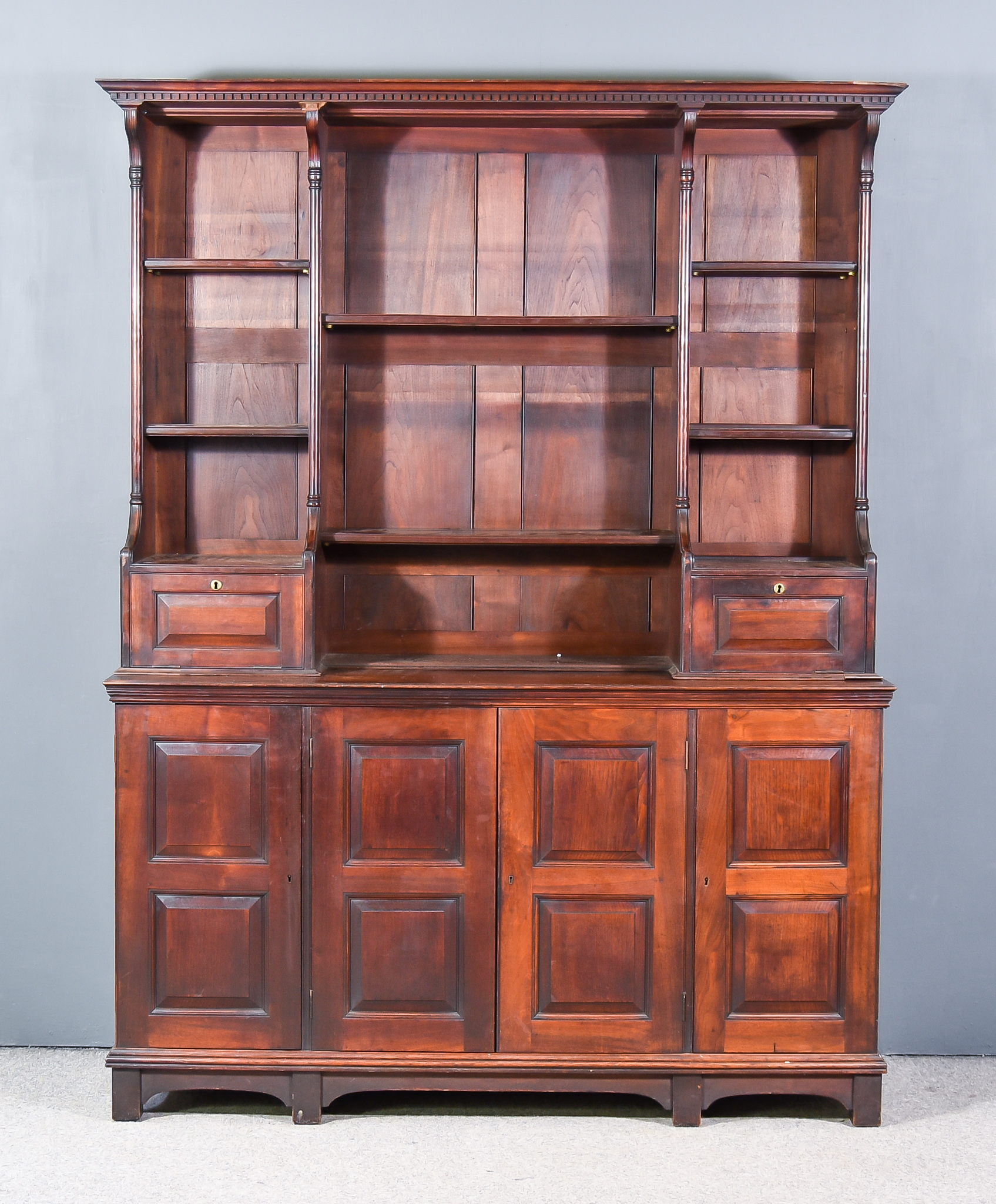 A 19th Century Mahogany Dresser, the upper part with moulded cornice above dentil frieze, fitted two