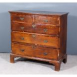 An 18th Century Oak and Mahogany Chest, with moulded square edge to top, fitted two short and