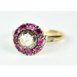 A 9ct Gold Ruby and Diamond Cluster Ring, 20th Century, set with a centre solitaire diamond,