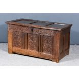 A 17th Century Panelled Oak Coffer, with three panels to top, with moulded rails and three panels to