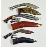Seven 20th Century Kukri Knives, each with scabbards, sizes various Note - You must be over 18 to