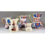 Eleven Ironstone Jugs - including Masons with Imari pattern in blue and red, 7ins high, another