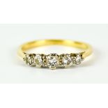 A Five Stone Diamond Ring, 20th Century, 18ct gold set with five small brilliant cut round diamonds,