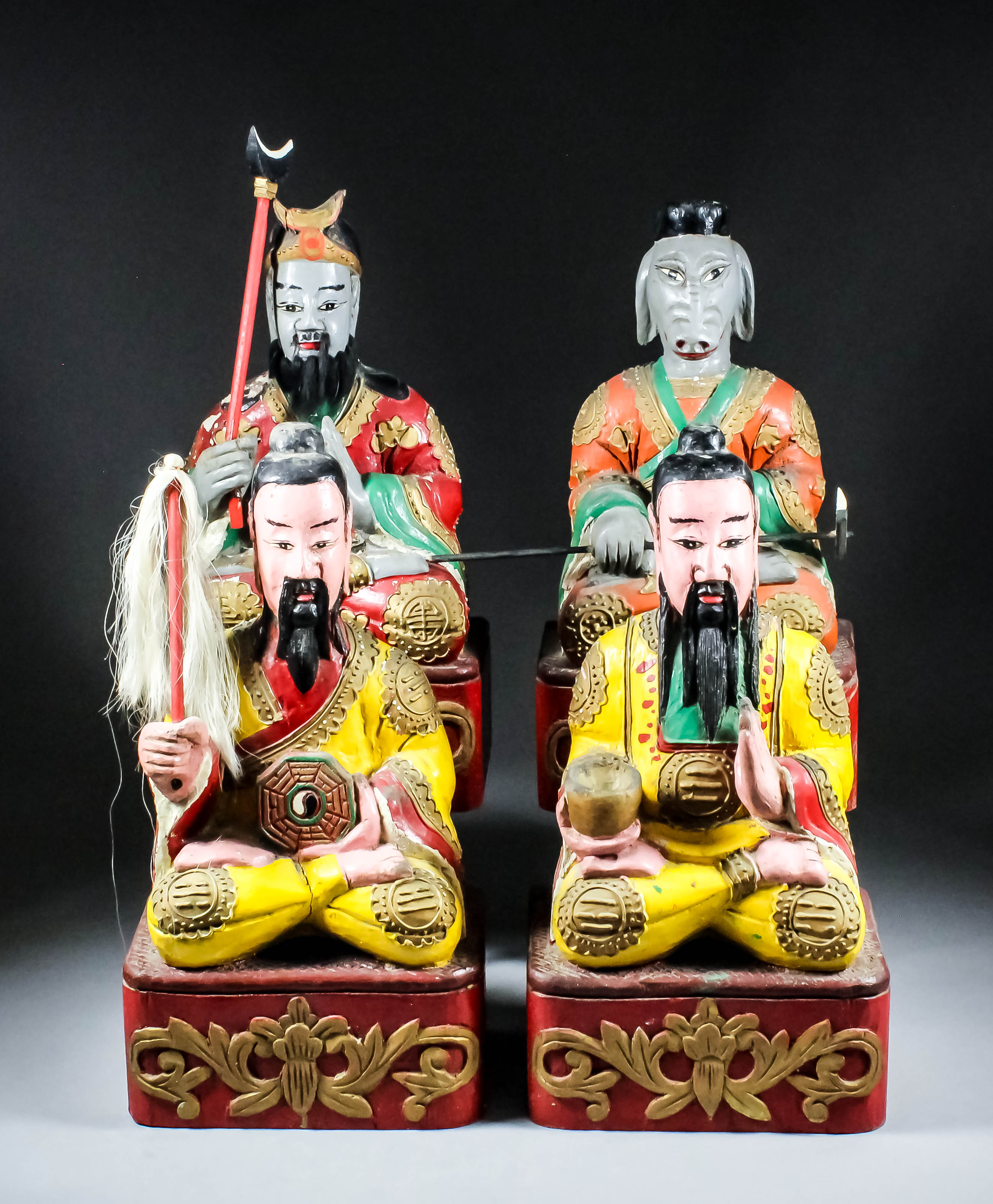 A Pair of Chinese Carved Polychrome Seated Figures of Bearded Daoist Gods, their yellow robes