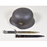 A German World War II Helmet, painted, with single decal, serial no. 066 and 373 to rear, leather
