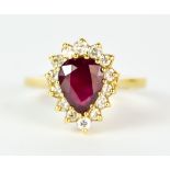 A Ruby and Diamond Ring, Modern, 18ct yellow gold, set with a centre pear shaped ruby, approximately